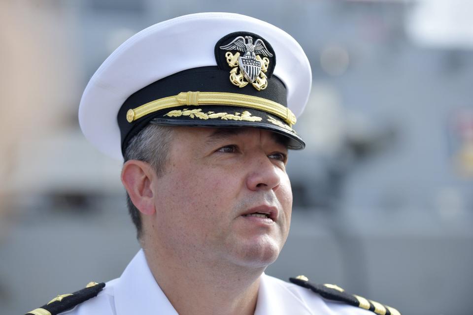 The USS Mason's commanding officer, Stephen Valerio, talks with members of the media as his ship is being secured to the pier at Naval Station Mayport Monday morning.