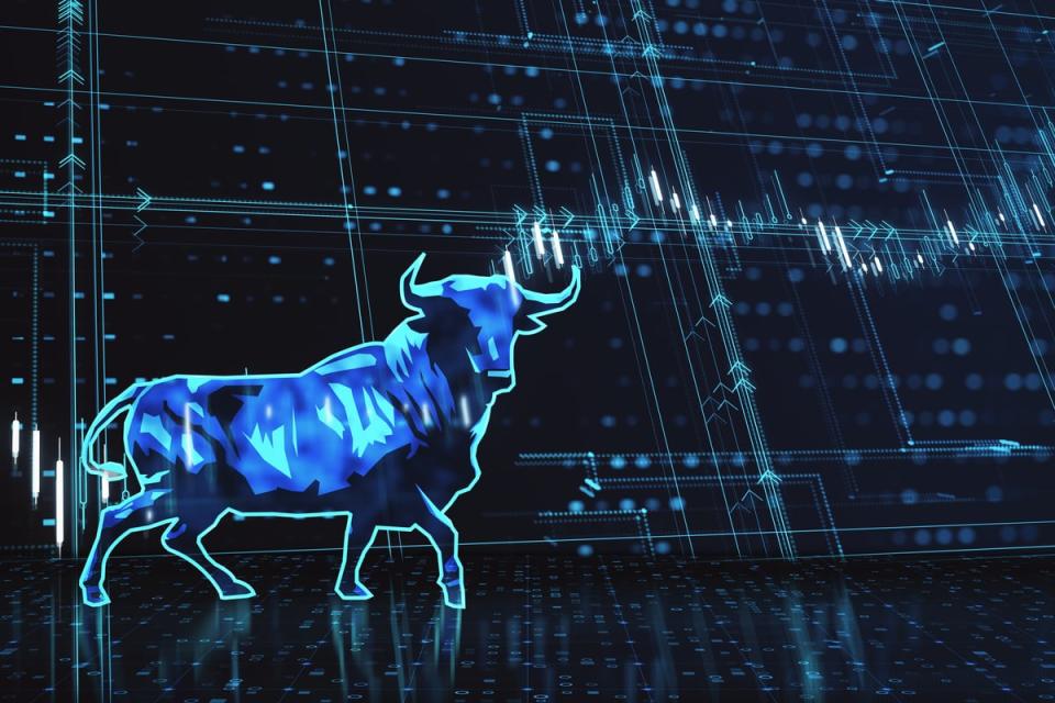 A holograph of a bull in front of a stock chart.