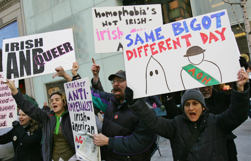 FILE - In this Friday, March 17, 2006 file photo, members of the Irish-American gay community protest on Fifth Avenue against the exclusion of Irish and Irish-American gays people from marching in the annual St. Patrick's Day Parade in New York. In 2014, mayors of New York and Boston say they’ll boycott St. Patrick’s Day parades to protest policies on gay groups. (AP Photo/Dima Gavrysh)