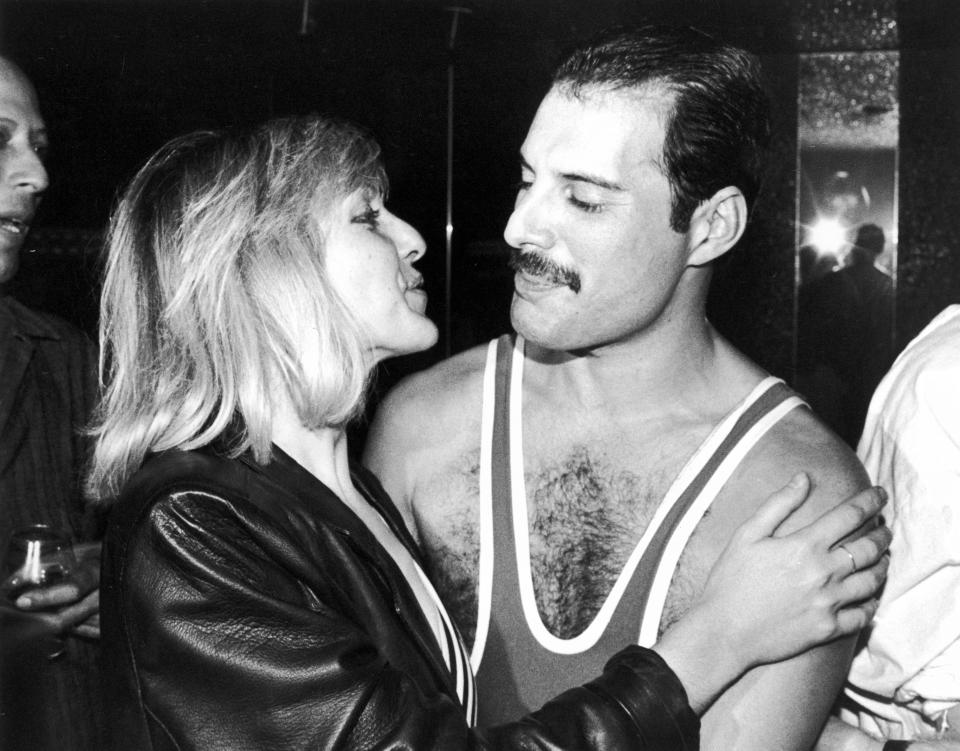 British singer, songwriter and record producer Freddie Mercury (1946 - 1991) of British rock band Queen with his friend Mary Austin, during Mercury's 38th birthday party at the Xenon nightclub, London, UK, September 1984. (Photo by Dave Hogan/Getty Images)