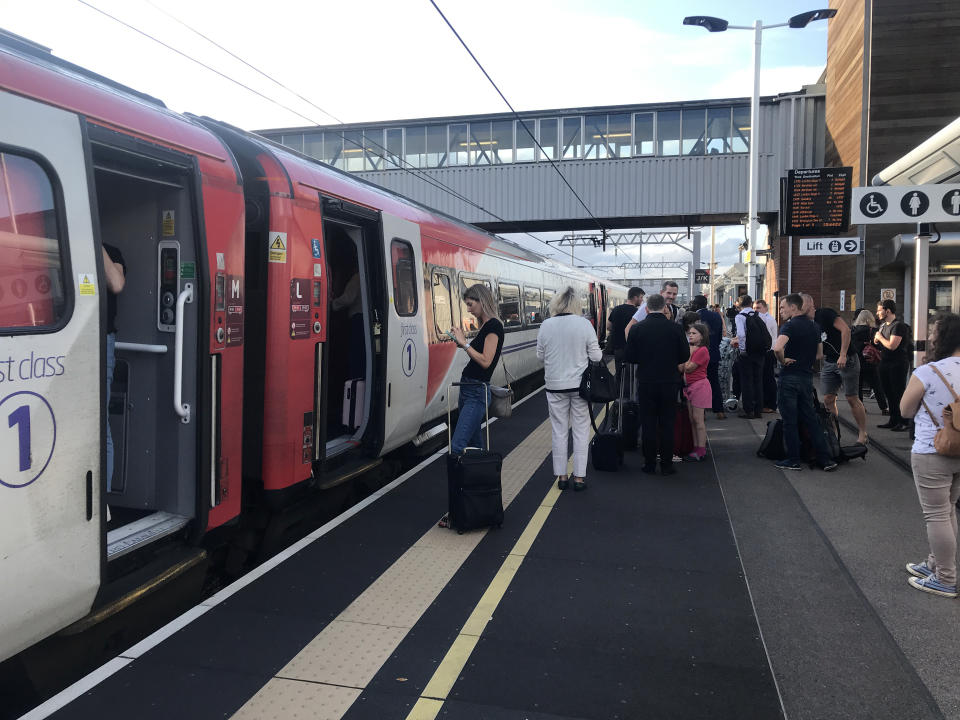 Passengers wait for news at Peterborough station during travel disruption on the East Coast mainline, after a large power cut has caused �apocalyptic� rush-hour scenes across England and Wales, with traffic lights down and trains coming to a standstill.