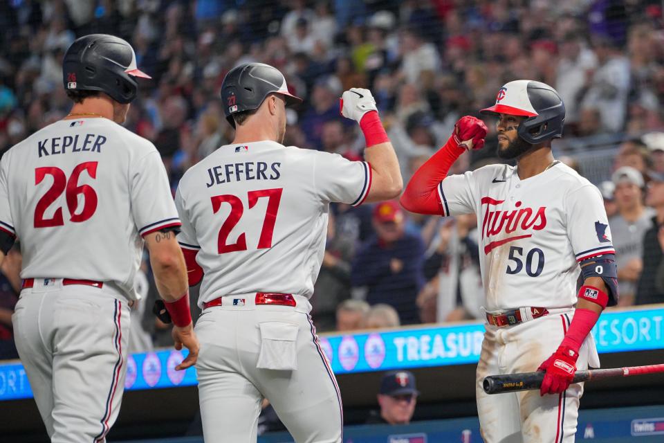 Minnesota Twins designated hitter Ryan Jeffers (27) celebrates his home run against the Oakland Athletics with teammates Willi Castro (50) and Max Kepler (26) on Sept. 27, 2023.