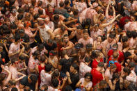 <p>Revellers enjoy the atmosphere in tomato pulp while participating the annual Tomatina festival on Aug. 30, 2017 in Bunol, Spain. (Photo: Pablo Blazquez Dominguez/Getty Images) </p>