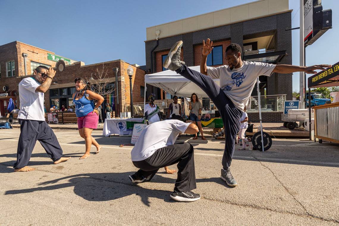 Lawrence French and Luis Muela of Fort Worth Capoeira do a Brazilian Martial Arts demonstration at Open Streets on Magnolia Avenue in Fort Worth on Saturday, April 13, 2024. Open Streets is a national movement encouraging innovative ways to achieve environmental, social, economic, and public health goals by temporarily closing streets to automobile traffic, so that people may use them for walking, bicycling, dancing, playing, and socializing. Chris Torres/ctorres@star-telegram.com