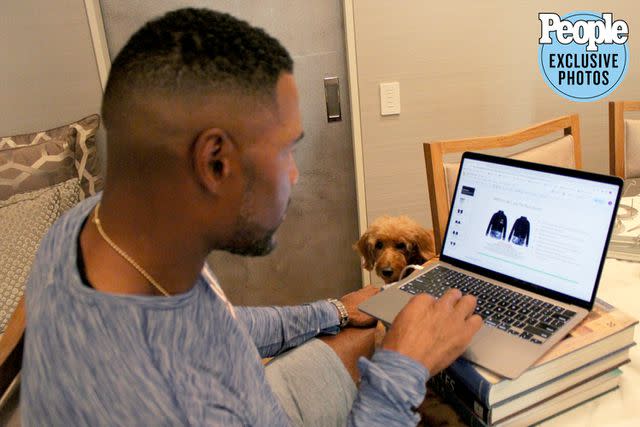 <p>Michael Strahan</p> Michael Strahan works from home on his MSX by Michael Strahan™ line for the NFL.