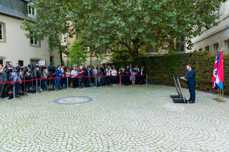 Luxembourg Prime Minister Xavier Bettel pointed in bitter amusement at the empty podium beside him as Prime Minister Boris Johnson ducked out of a planned news conference