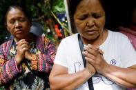 <p>Christian volunteers pray near the Tham Luang cave complex during a search for members of an under-16 soccer team and their coach, in the northern province of Chiang Rai, Thailand, June 27, 2018. (Photo: Soe Zeya Tun/Reuters) </p>