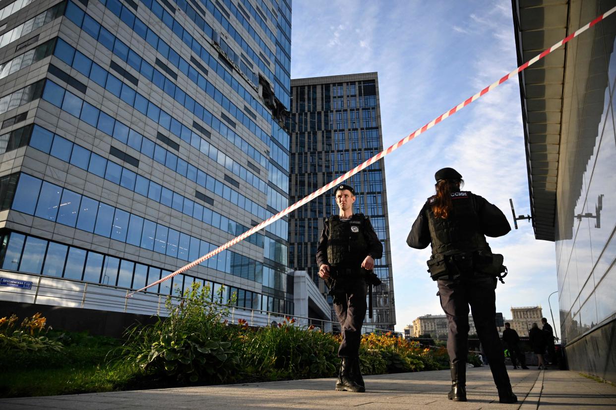 Police officers block off an area around a damaged office block of the Moscow International Business Center following a reported drone attack in Moscow (AFP via Getty Images)