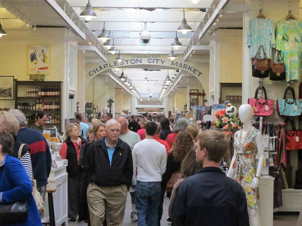 Visitors crowd the popular City Market in in Charleston, S.C. on March 11, 2013. The Market has vendors selling everything from T-shirts and jewelry to paintings and pocketbooks but it's free to wander through and is a great place to people watch. (AP Photo/Bruce Smith)