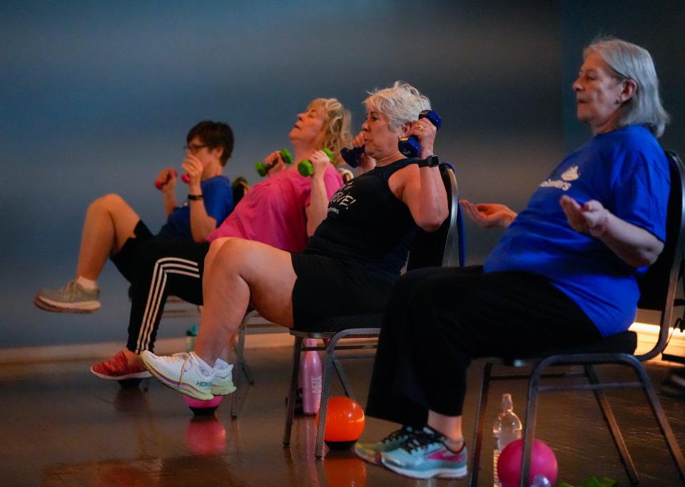 Seniors participate in Lorrie Ward's SilverSneakers Stability class in Phoenix on July 12, 2022. The class is designated to decrease risk of falls for participants 65 years and older.