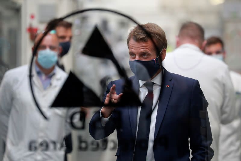 French President Emmanuel Macron visits a factory of manufacturer Valeo, in Etaples