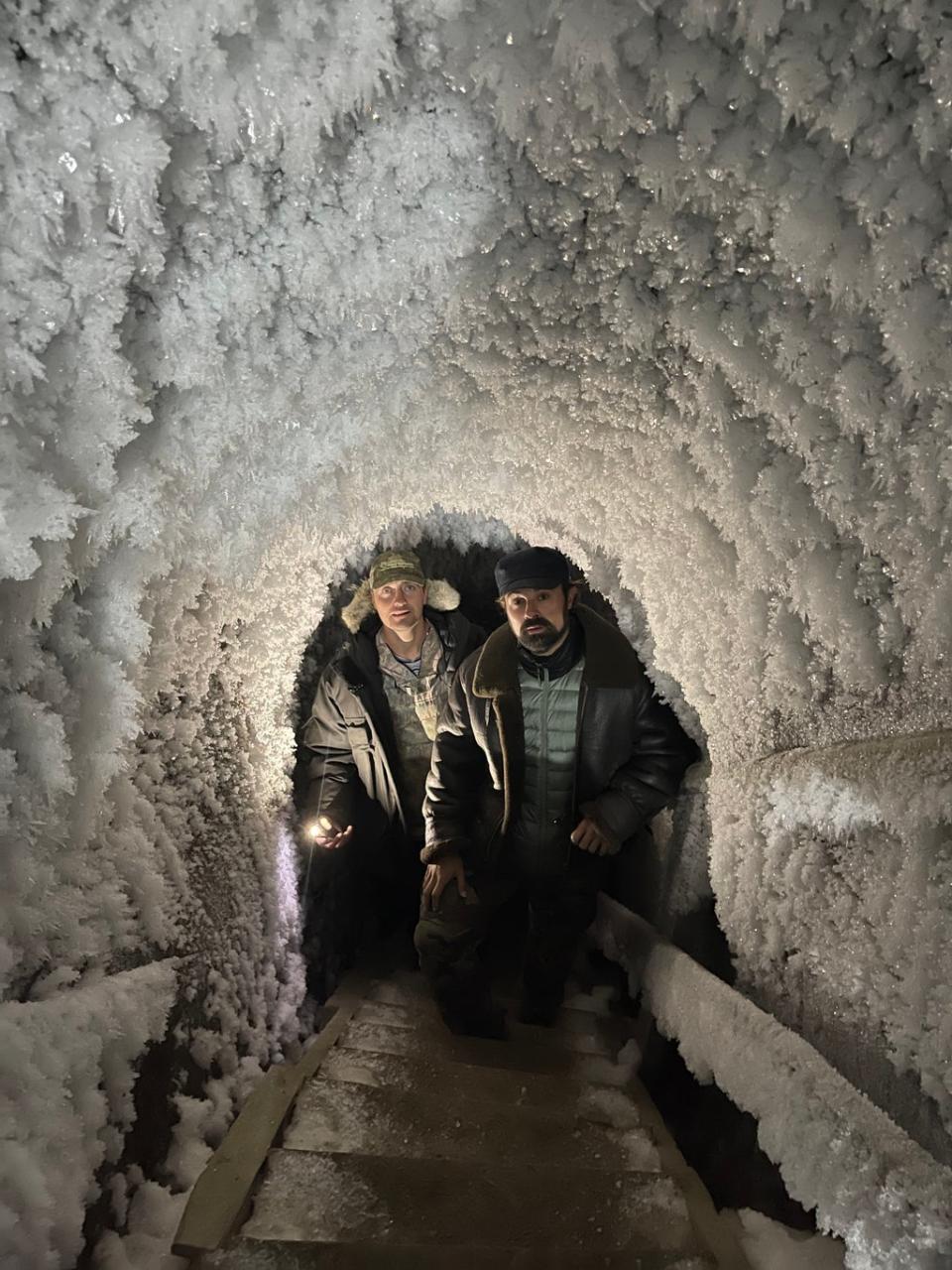 Nikita Zimov takes Evgeny Lebedev into an ice cave, tunnelling deep into the permafrost (Valentina Morriconi)