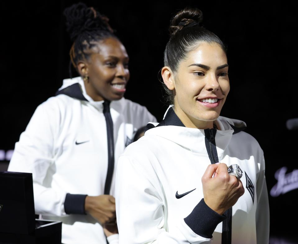 Chelsea Gray (L) #12 and Kelsey Plum #10 of the Las Vegas Aces receive their 2023 WNBA championship rings before the team's home opener against the Phoenix Mercury on May 14, 2024, in Las Vegas, Nevada.