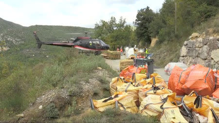 Provisions are airlifted by a helicopter to and from the villages left isolated after a rockslide in April, in Sospel, France October 17, 2018 in this still image taken from a video on October 19, 2018. Reuters TV/via REUTERS