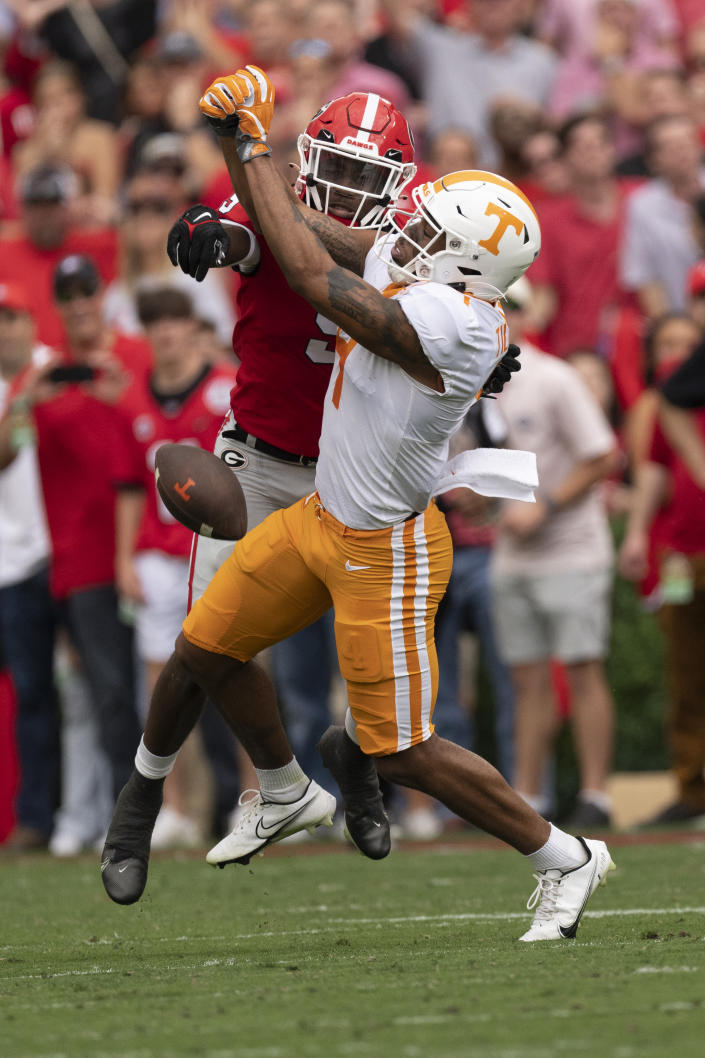 Georgia defensive back Jaheim Singletary (9) breaks up a pass intended for Tennessee wide receiver Cedric Tillman (4) during the first half of an NCAA college football game Saturday, Nov. 5, 2022 in Athens, Ga. (AP Photo/John Bazemore)