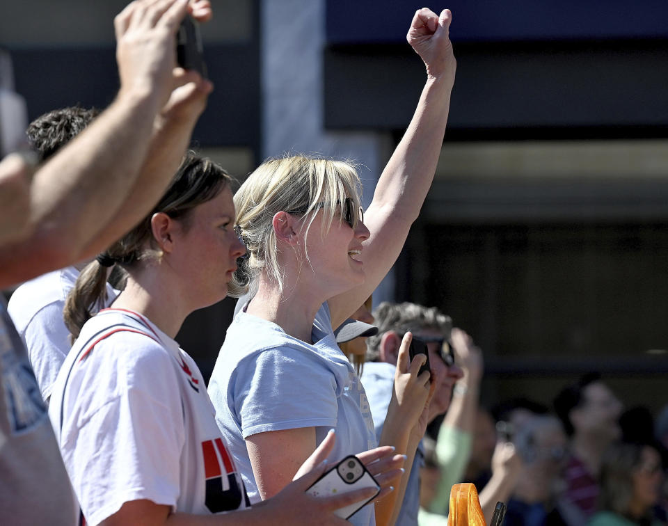 Allyson Moore, of Vermont, cheers for Indiana State University and Boston Celtics great Larry Bird after he was introduced to speak during the grand opening ceremony for the Larry Bird Museum, Thursday, May 30, 2024, in Terre Haute, Ind. (Joseph C. Garza/The Tribune-Star via AP)