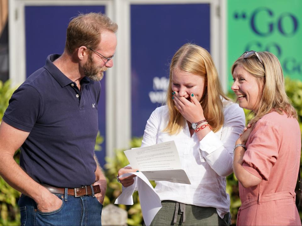 A students reacts when reading their A-level results at Norwich School (PA)