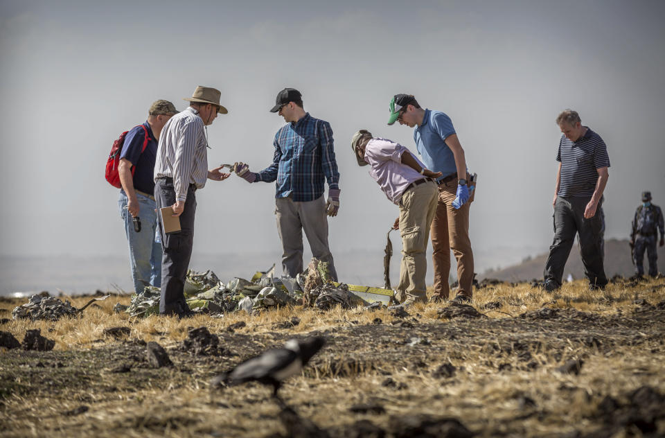 Foreign investigators examine wreckage at the scene where the Ethiopian Airlines Boeing 737 Max 8 crashed shortly after takeoff on Sunday killing all 157 on board, near Bishoftu, or Debre Zeit, south of Addis Ababa, in Ethiopia March 12, 2019. (Photo: Mulugeta Ayene/AP)