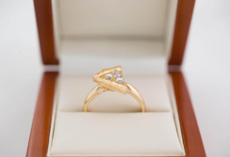 Pizza lovers rejoice you can now propose with a pizza slice engagement ring [Photo: Dominos]