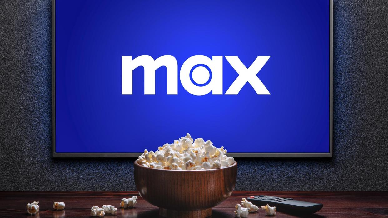  Max on a TV screen with a bowl of popcorn. 