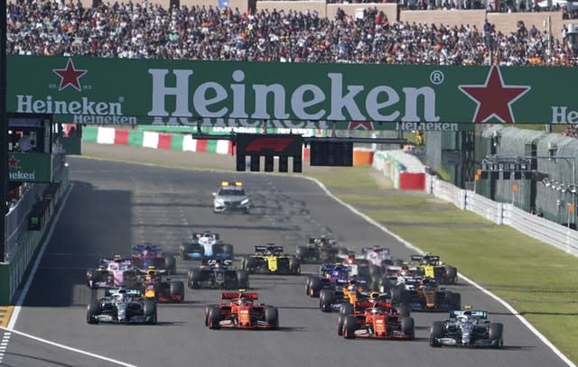 Valtteri Bottas, right, passes Sebastian Vettel, second right,  off the start line