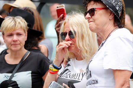 Fans cry as they gather at Forest Lawn Cemetery ten years after the death of child star turned King of Pop, Michael Jackson, in Glendale, California