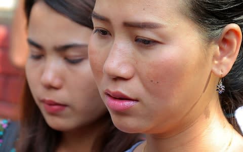 Chit Su Win and Panei Mon, the reporters' wives, were despondent about the appeal verdict - Credit: Sai Aung Main/AFP