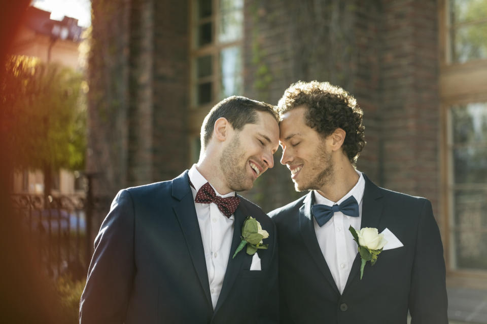 two grooms at their wedding