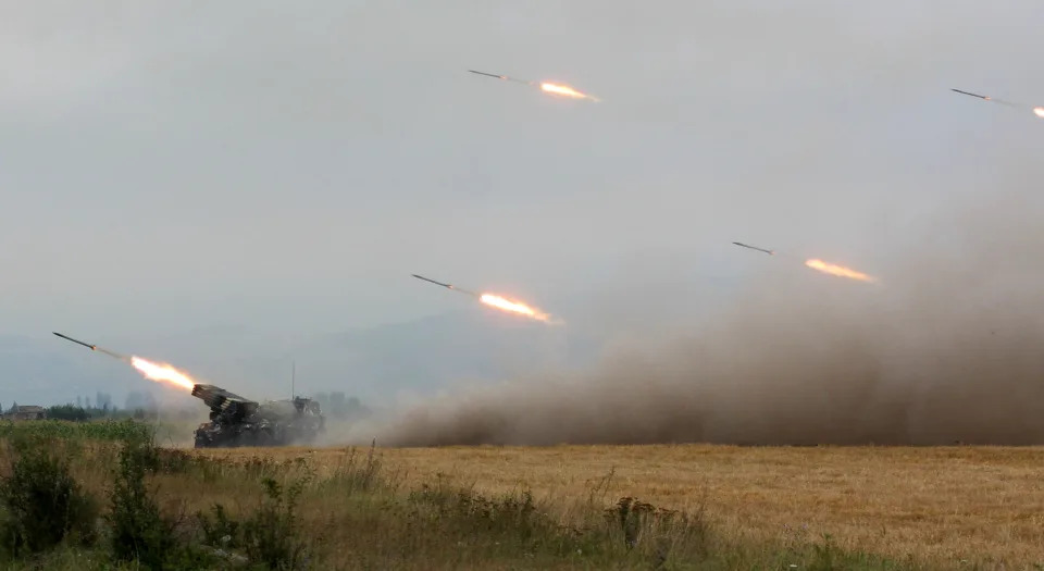 Georgian troops fire rockets at seperatist South Ossetian troops in August 2008.