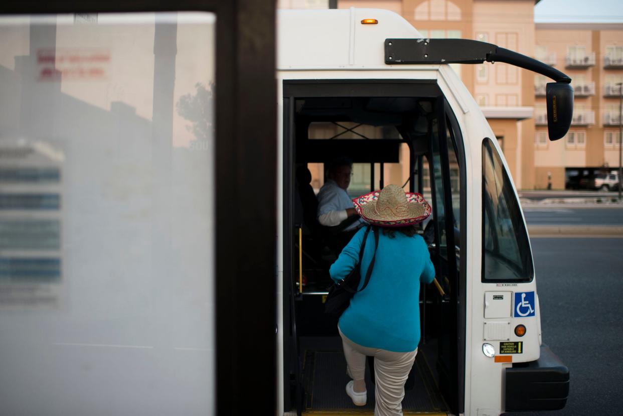 A woman in a sombrero gets on a bus Tuesday, May 5 in Ocean City.