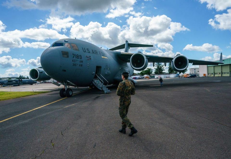 A US soldier walking past a C-17.