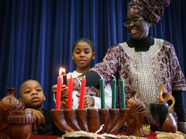 <p>David Cooper/Toronto Star via Getty</p> The Markham African Caribbean Canadian Association's Kwanzaa celebration at the Milliken Mills High School on December 14, 2013.