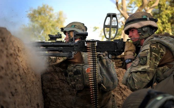 Soldiers from the Royal Irish Regiment react to a Taliban ambush. Helmand, southern Afghanistan. - Rupert Frere RLC/Crown Copyright