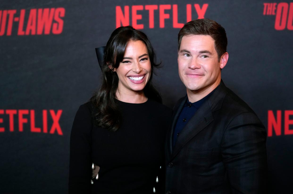 Chloe Bridges and Adam DeVine walk the red carpet for "The Out-Laws."