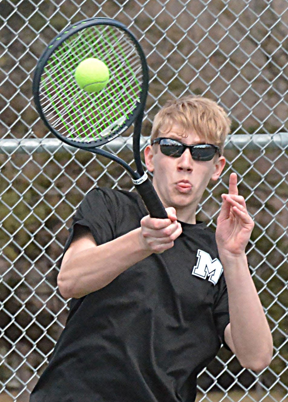 Milbank's Charles Whitesitt hits a return shot during a high school boys tennis dual against Watertown on Tuesday, April 9, 2024 at the Highland Park courts in Watertown.