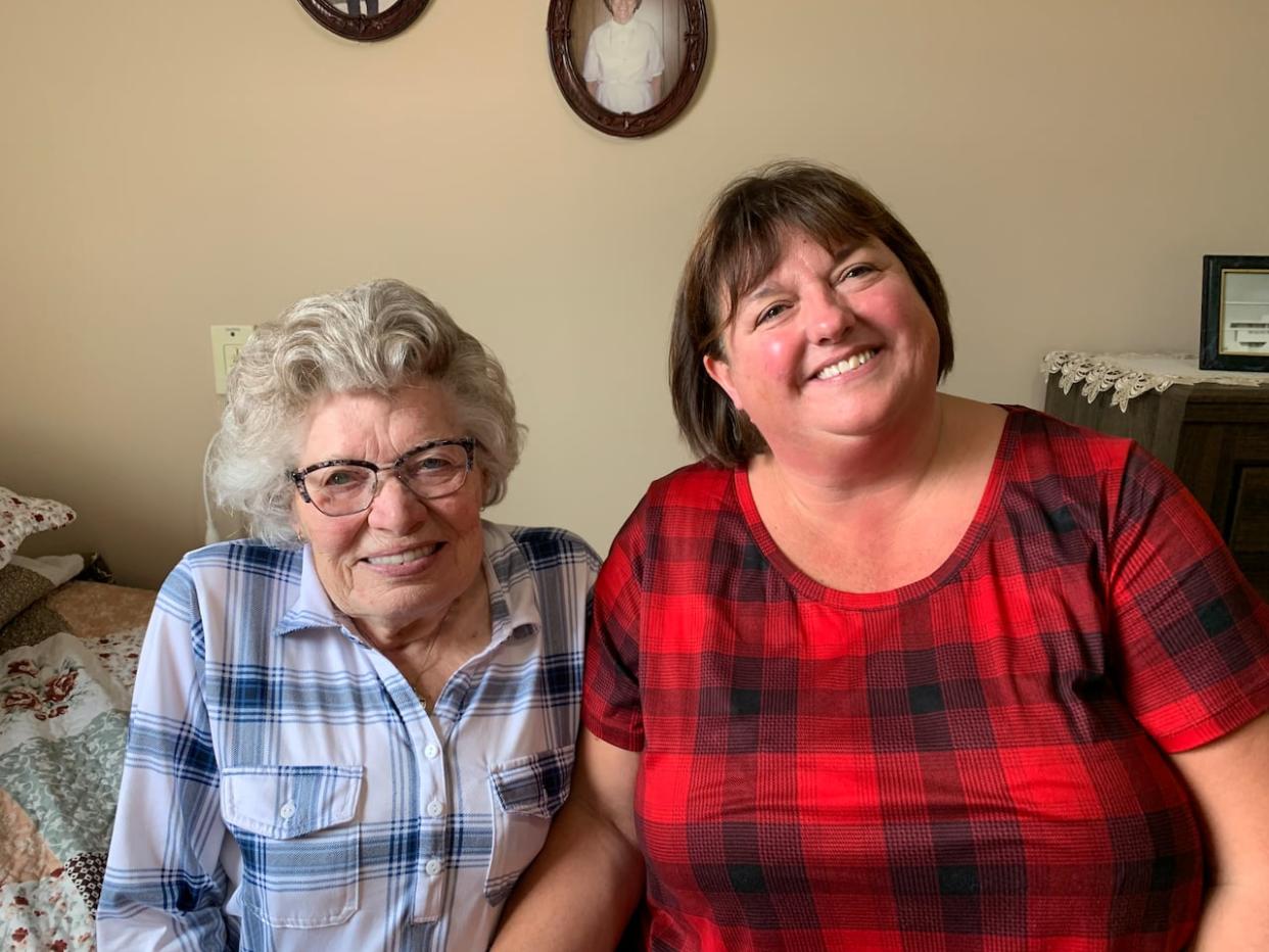 Loretta Burrell (on left) has donated money to the Stephenville High Scholarship and Bursary Committee, of which Lynn MacDonald is chairperson. The Tom and Loretta Burrell Scholarship will be presented for the first time on Sunday, December 17. (Bernice Hillier/CBC - image credit)