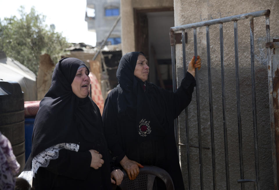 Relatives of Hamas security forces member, Mahmoud al-Adham, 28, mourn during his funeral in the town of Jabaliya, northern Gaza Strip, Thursday, July 11, 2019. Hamas' armed wing said Thursday that Israeli the army "deliberately" fired at al-Adham, in the northern town of Beit Hanoun. The Israeli military said it noticed two "armed suspects" near the Gaza-Israel perimeter fence and responded with warning shots. (AP Photo/Khalil Hamra)