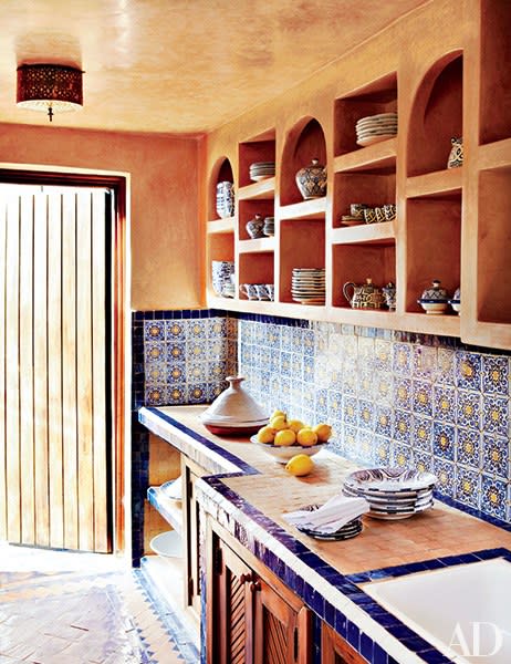 A backsplash of antique tiles warms up this terra-cotta kitchen in Essaouira, Morocco.