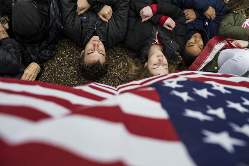 Protesters&nbsp;lie on the ground during a demonstration supporting gun control.