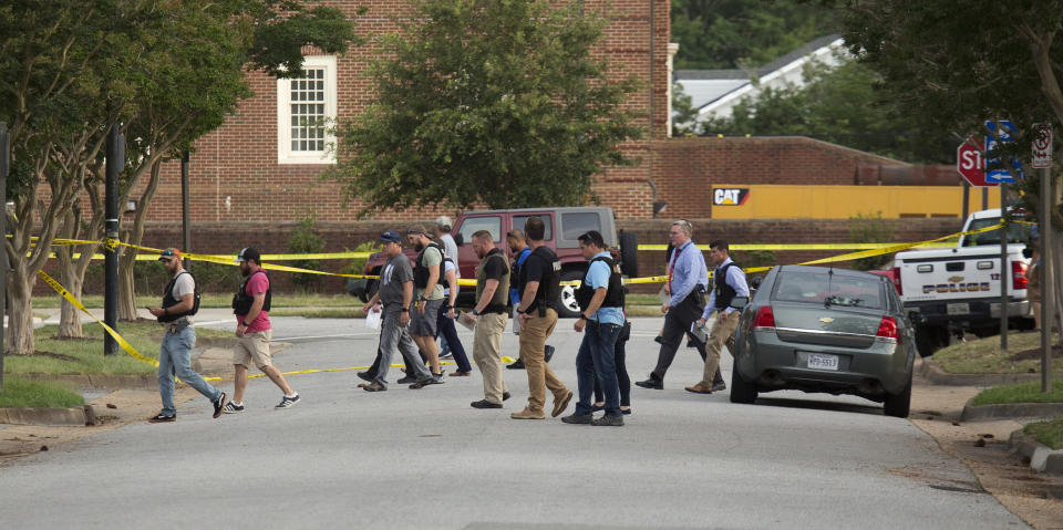 Police work the scene where eleven people were killed during a mass shooting at the Virginia Beach city public works building, May 31, 2019 in Virginia Beach, Va.  (Photo: L. Todd Spencer/The Virginian-Pilot via AP)