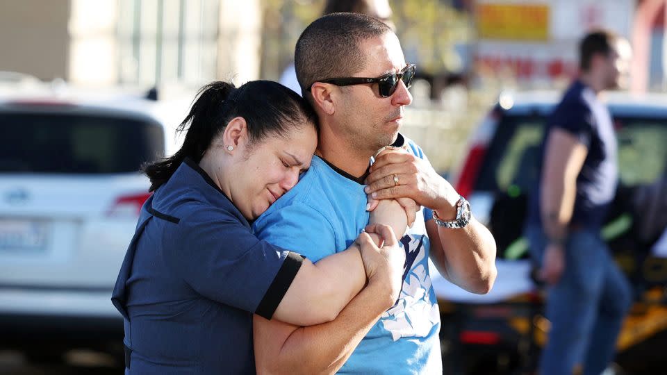 Parents Mabel Fontanilla and Raul Villalonga embrace after a shooting at the University of Nevada, Las Vegas, campus on Wednesday. - Ronda Churchill/AFP/Getty Images