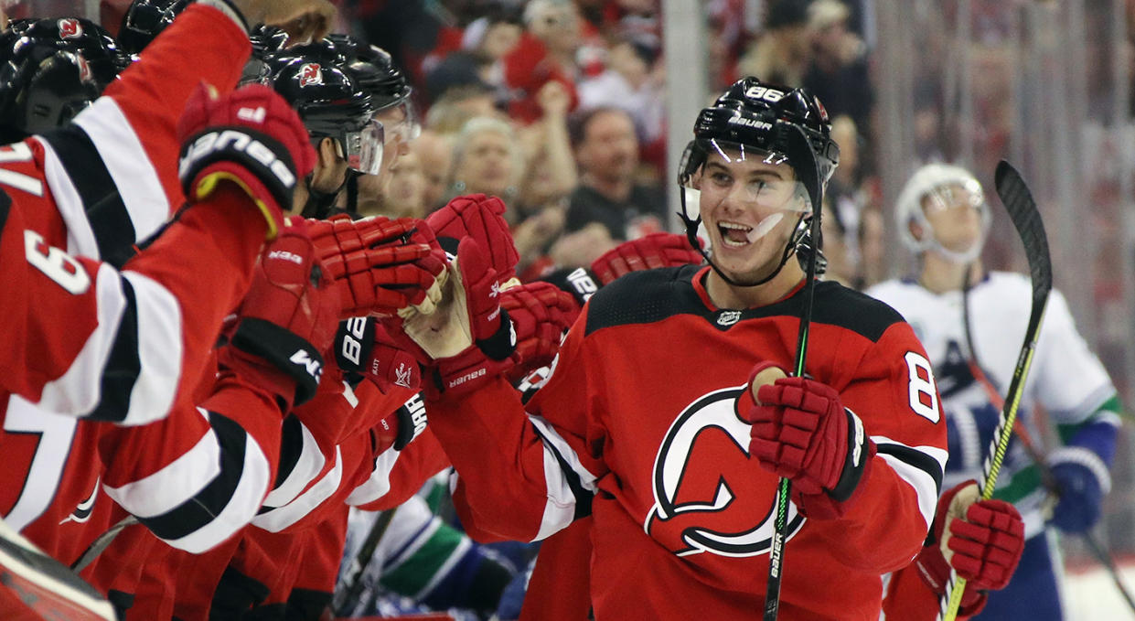 NEWARK, NEW JERSEY - OCTOBER 19: Jack Hughes #86 of the New Jersey Devils celebrates his first NHL goal as he scores at 14:08 of the first period on the power-play against the Vancouver Canucks at the Prudential Center on October 19, 2019 in Newark, New Jersey. (Photo by Bruce Bennett/Getty Images)