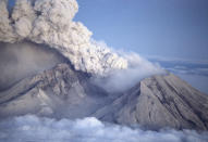 FILE - Volcanic ash and steam rises from Mount St. Helens, Wash., as it erupted, May 18, 1980. The ground is shaking and swelling at Mauna Loa, the largest active volcano in the world, indicating that it could erupt. Hawaii volcanoes like Mauna Loa tend not to have explosive eruptions like Mount St. Helens in Washington state. That's because Hawaii's volcanoes have magma that's hotter, drier and more fluid, and doesn't trap as much gas, according to Hannah Dietterich, a research geophysicist at the U.S. Geological Survey's Alaska Volcano Observatory. (AP Photo/File)