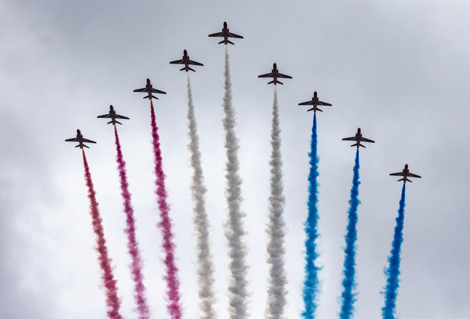 LONDON, ENGLAND - MAY 06: The Red Arrows take part in the fly past after the Coronation of King Charles III and Queen Camilla on May 6, 2023 in London, England. The Coronation of Charles III and his wife, Camilla, as King and Queen of the United Kingdom of Great Britain and Northern Ireland, and the other Commonwealth realms takes place at Westminster Abbey today. Charles acceded to the throne on 8 September 2022, upon the death of his mother, Elizabeth II. (Photo by Adam Gerrard - WPA Pool/Getty Images)