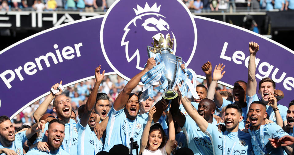 File photo dated 06-05-2018 of Manchester City's Vincent Kompany (centre left), Yaya Toure (centre right) and Sergio Aguero (second right) lift the Premier League trophy after the Premier League match at the Etihad Stadium, Manchester.