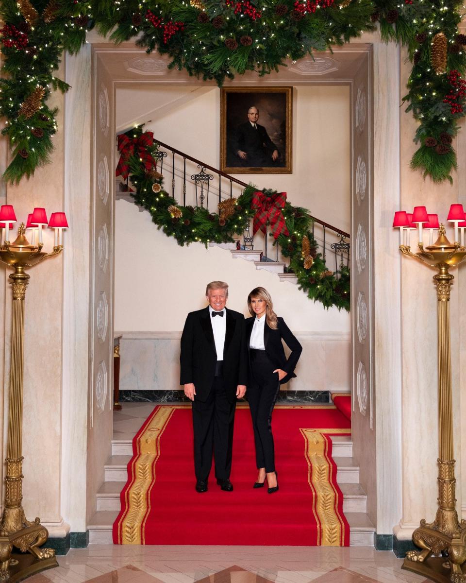 President Donald Trump and First Lady Melania Trump in their official 2020 Christmas portrait, on the Grand staircase of the White House in Washington.