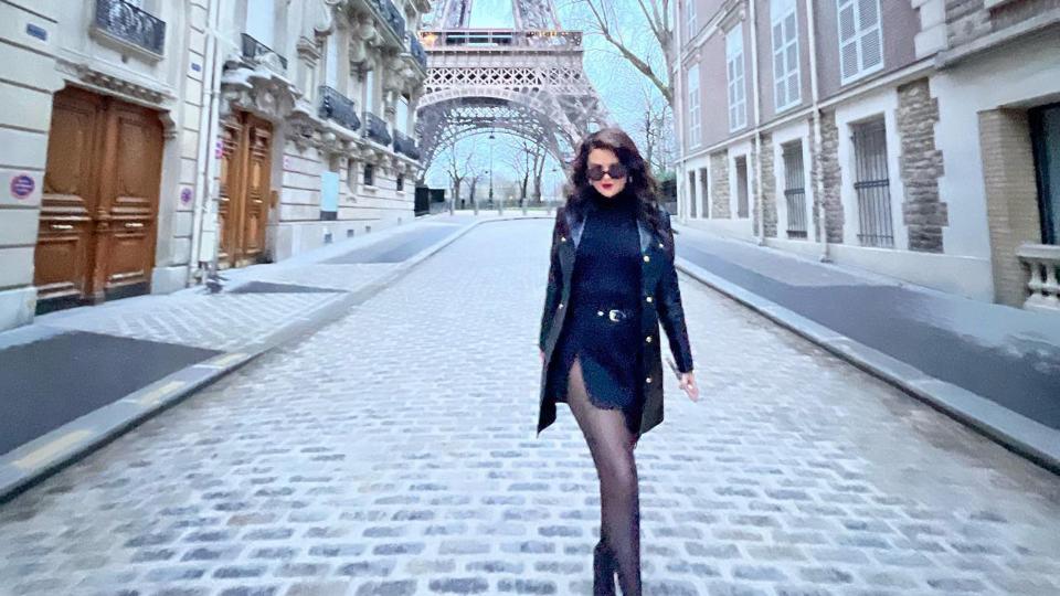 Selena Gomez post a photo of her in an all-black outfit in front of the Eiffel Tower in Paris