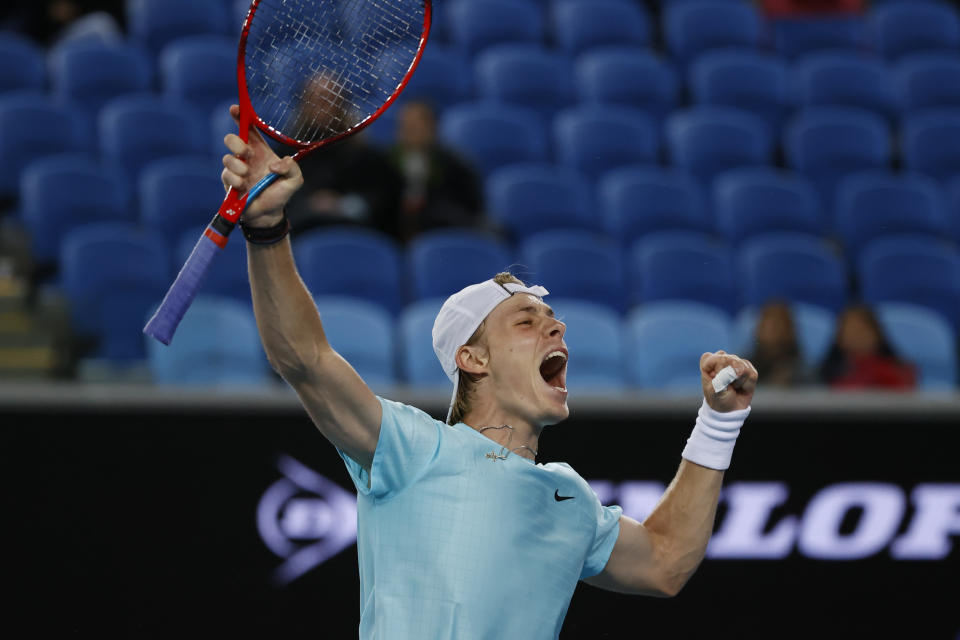 Canada's Denis Shapovalov reacts after defeating Italy's Jannik Sinner during the first round match at the Australian Open tennis championship in Melbourne, Australia, Monday, Feb. 8, 2021. (AP Photo/Rick Rycroft)