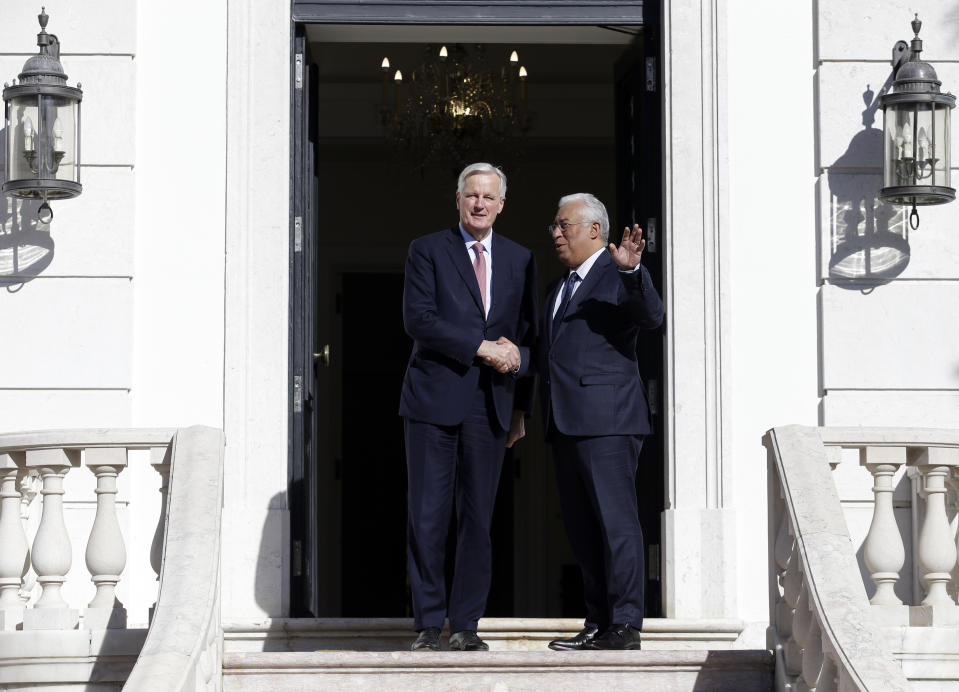 European Union chief Brexit negotiator Michel Barnier, left, and Portuguese Prime Minister Antonio Costa pose for the cameras before their talks at the Sao Bento palace in Lisbon, Thursday, Jan. 17 2019. Barnier says he hopes British Prime Minister Theresa May's consultations with national political leaders can help break the deadlock over the terms of the U.K.'s departure from the EU and herald "a new stage" in Brexit negotiations.(AP Photo/Armando Franca)