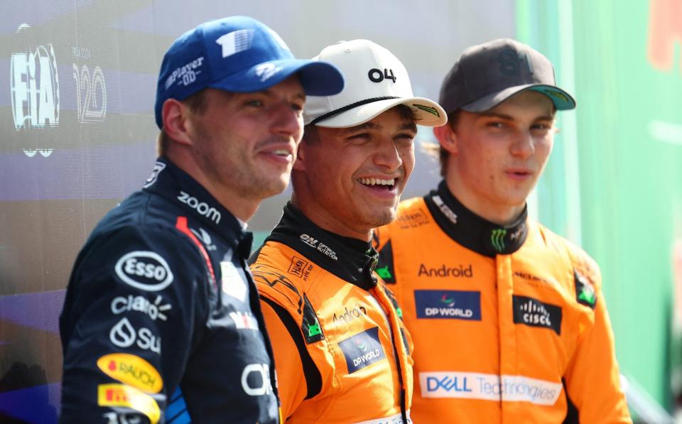 McLaren's Lando Norris celebrates after qualifying in pole position with second placed Red Bull's Max Verstappen and third placed McLaren's Oscar Piastri